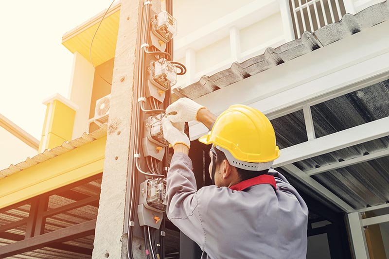 Electrician in a gray uniform